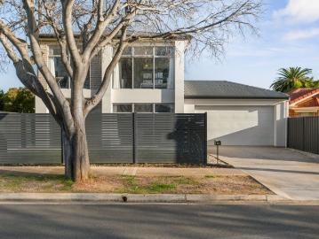 Low maintenance, dual level living that makes you fall...