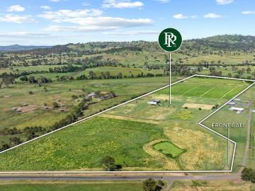 Productive Riverfront Acreage with Water and Equine...